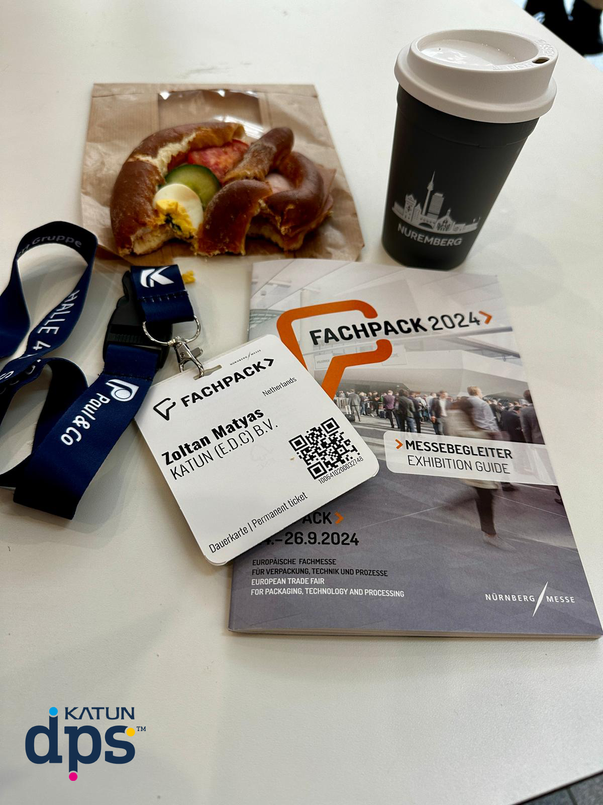 Fachpack visitor pass with catalogue, food, and drink